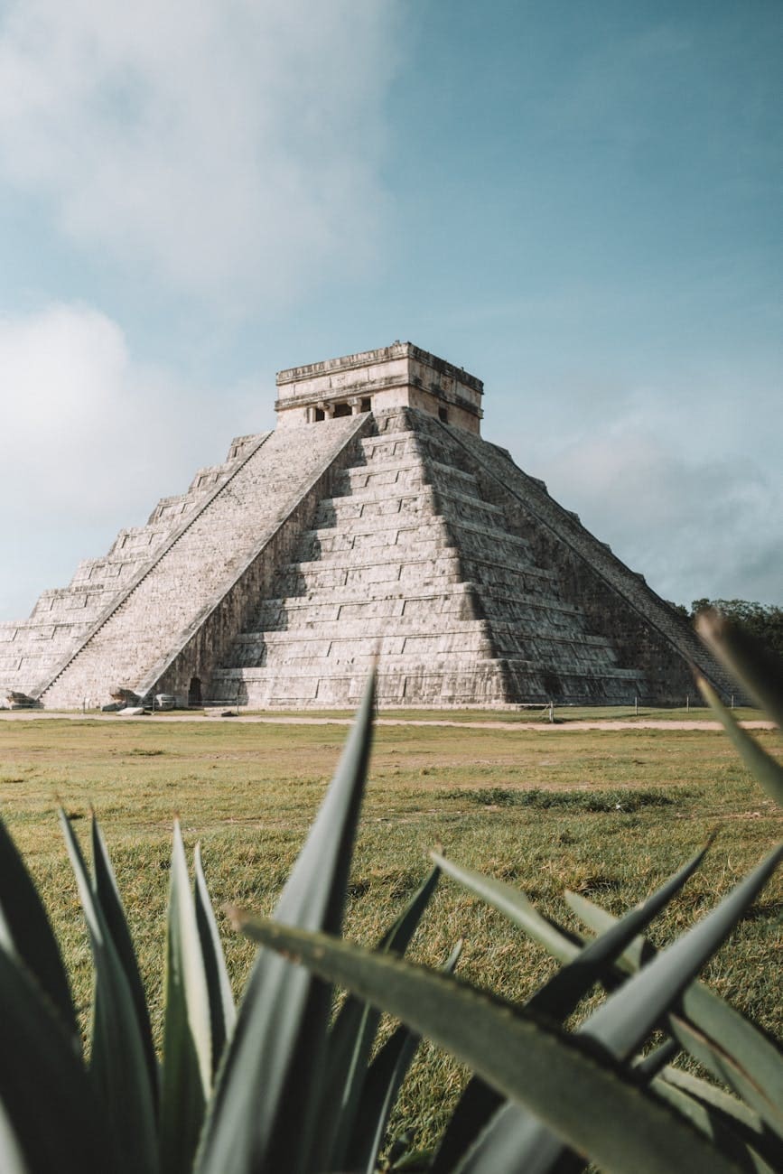 gray pyramid on grass field during day