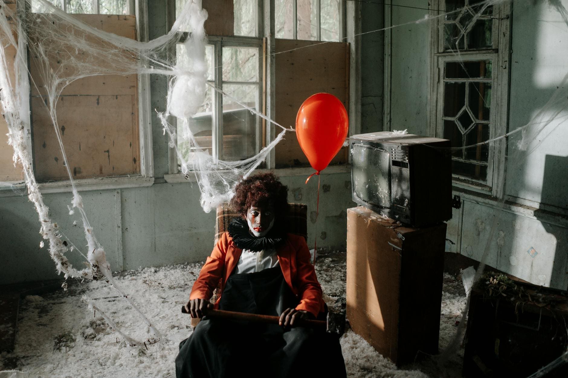 scary clown in an abandoned building